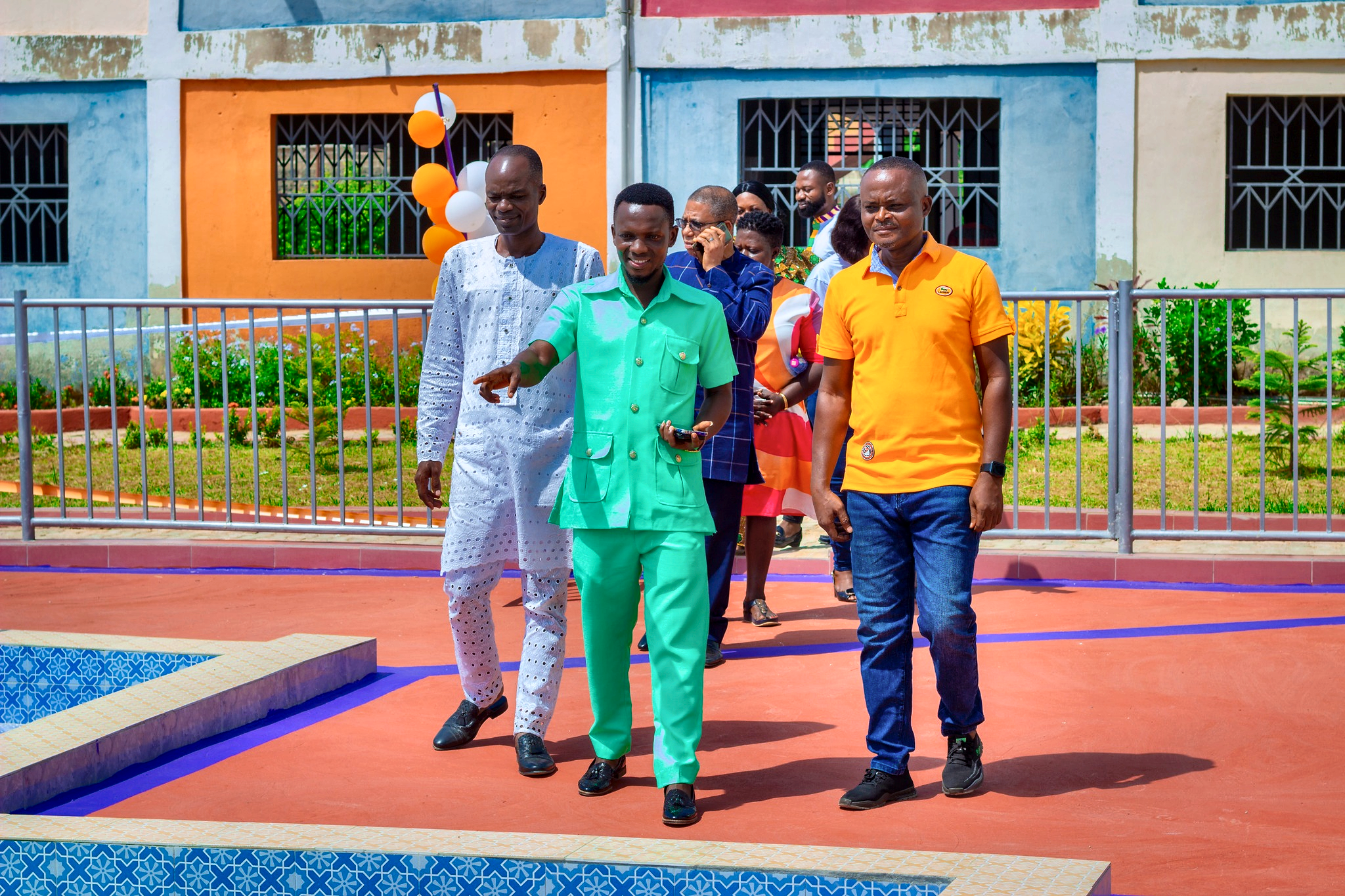 Artic School staff and guests beside the swimming pool